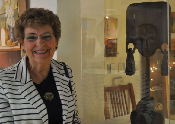 Nathalie standing by "Bejewelled" made of a single piece of Wenge wood.